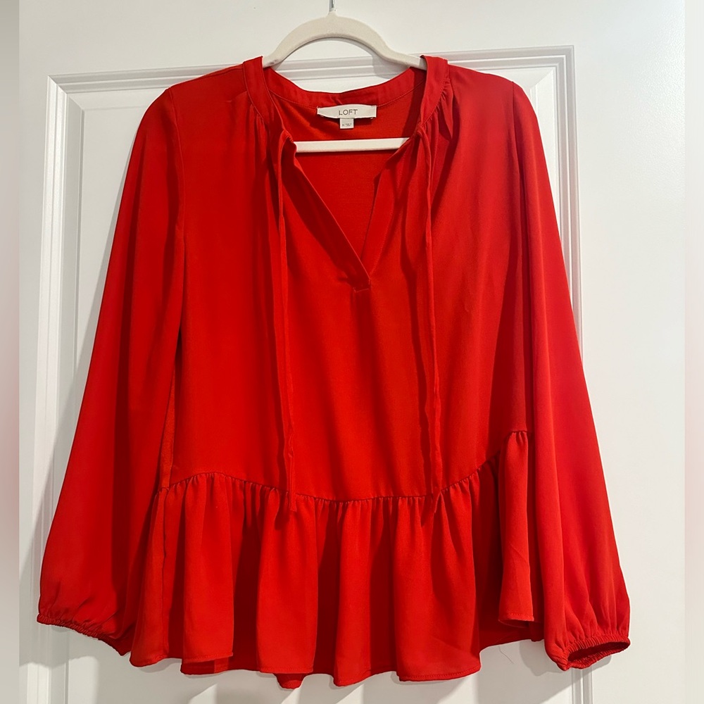 Long sleeve, tie neck, peplum top